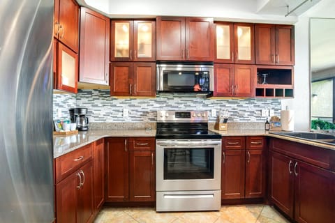 Sophisticated finishes meet casual island comfort in this stylish kitchen.