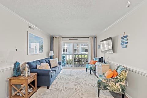 This comfy living room offers space for everyone to gather!