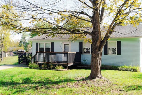 Exterior: Relax on the deck under the shade of a large tree in this charming getaway!