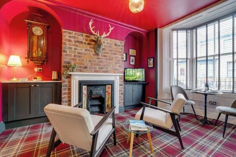 An open-plan living room with indoor fireplace, dining area and kitchen, benefit from a SMART TV with Netflix and plenty of space to sit down and relax. 