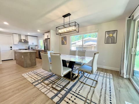 2nd-floor dining area features a dining table that comfortably seats six