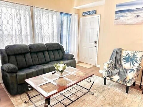 Our spacious living room is designed with your comfort in mind. The sofa has 2 built-in recliners 