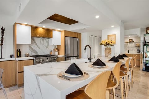 Welcome to “Karibu Nyumbani” – which translates to “Welcome Home”  
Nestled within the exclusive, gated community of Cathedral Canyon Country Club, “Karibu Nyumbani” is a home that embodies a spirit of hospitality & warmth, inviting people to peace.
