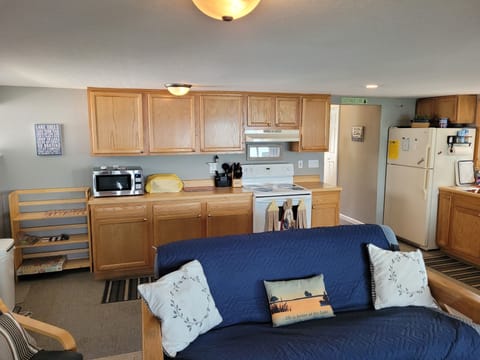 KITCHEN: Full kitchen with a good supply of cooking and dining utensils. All appliances except for a dishwasher.