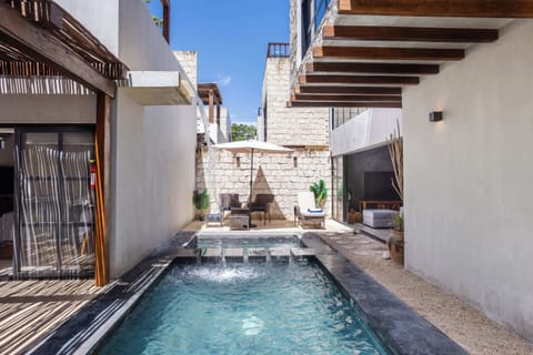 As you enter, to the left side is the guest house which houses Bedroom 1 and the private rooftop terrace