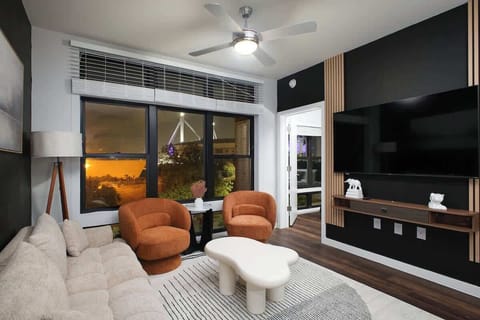 Relax in our cozy living room, where comfy sofas, large windows, and vibrant greenery create a serene ambiance.