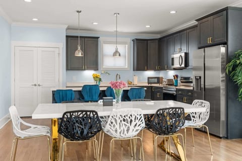 Gather for meals together at the elegant dining table, seating 8