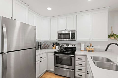 Kitchen with drip coffee pot, slow cooker, blender, toaster, and more