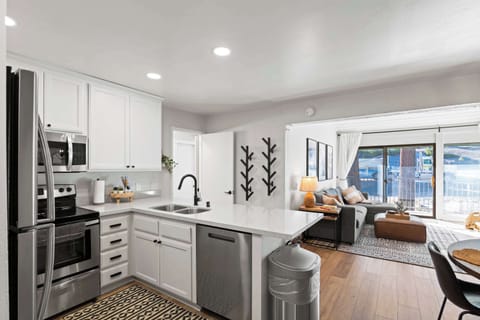 Kitchen with drip coffee pot, slow cooker, blender, toaster, and more