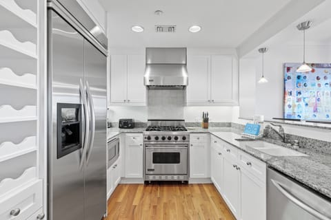 Your fully-equipped kitchen awaits with granite countertops, stainless steel appliances, and everything needed to create memorable meals.