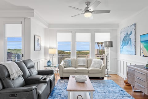 Relax in your bright coastal living room with ocean views and comfortable seating for memorable evenings.