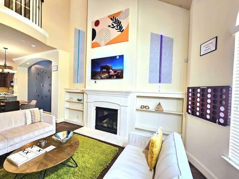 Modern comfort meets elegance in this stylish, art-filled living room.