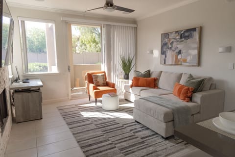 Sunny living room with dedicated workspace in corner
