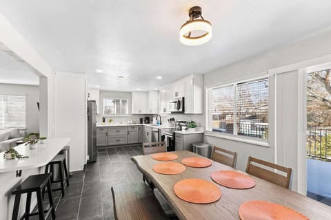 The kitchen features a 6 person dining table.