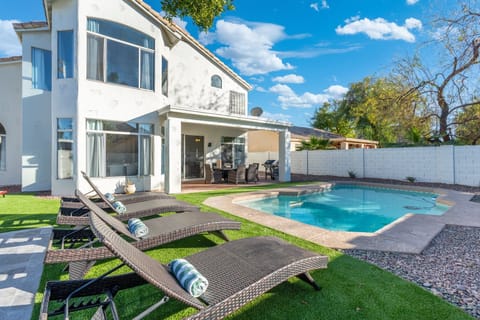 Backyard features plenty of space to lounge, relax, enjoy activities or the pool