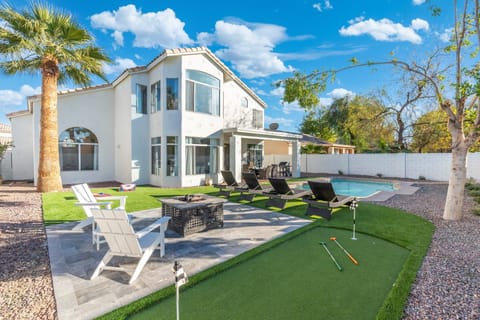 Relax in our beautiful backyard! Complete with firepit, loungers, & WEBER grill