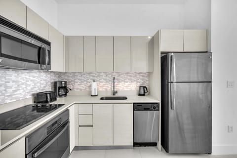 Cook with ease in the full kitchen, complete with essential appliances, cookware, and ample space.