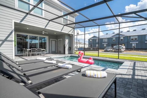 Make a splash in your private, screened pool-sun loungers, sparkling water, and a fun flamingo float await. Dine alfresco under the covered lanai with ceiling fan, perfect for lazy Florida days and breezy nights.