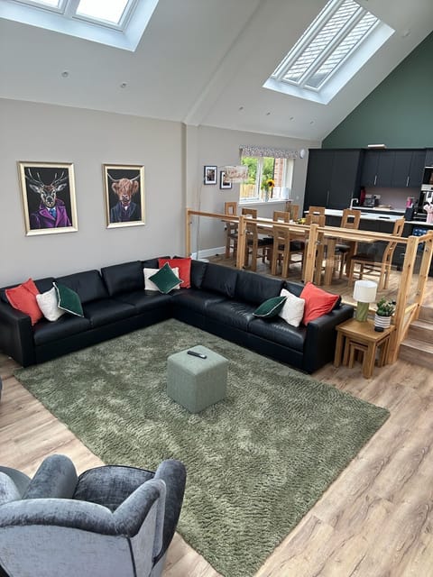 Lovely open living space with TV and plenty of seating.