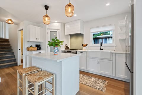 Enjoy a glass of wine on this kitchen island!