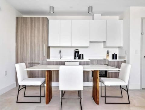 Modern dining area with seating for four.