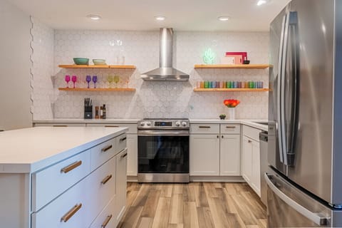 Spacious kitchen with hardwood flooring