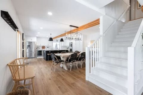Stairs and open kitchen/dining area