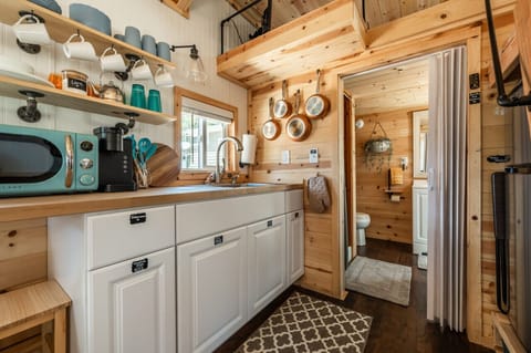Rustic charm meets modern convenience in this compact living space.