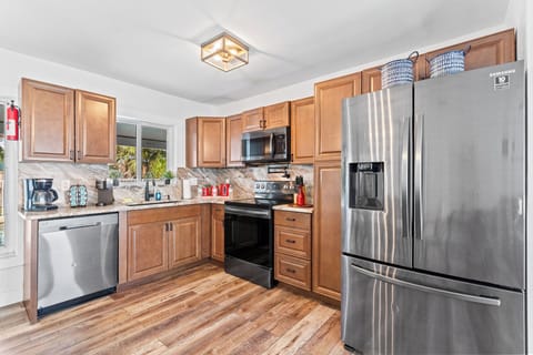 fully stock clean kitchen with everything that you need for cooking and baking, 