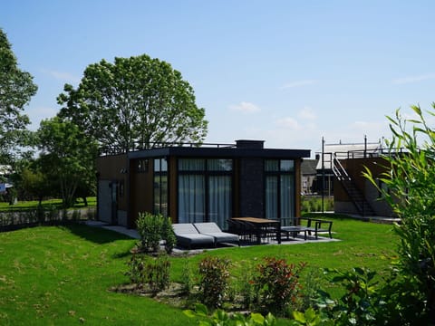 Plant, Sky, Building, Shade, Land Lot, Tree, Cloud, Cottage, Real Estate, Grass