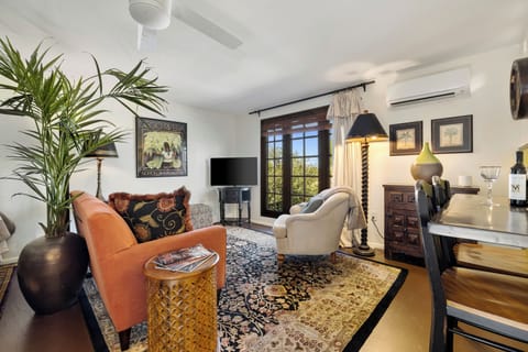 Step into a cozy living room with timeless, eclectic charm and enjoy lovely views from every angle