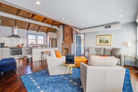 Spacious living room with seating for your entire group + kitchen with island seating for two