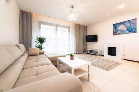 Comfortable Living Room with Sofa Bed and Smart TV | Book Now with RENTUJEMY