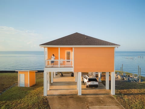 Bedroom 1. Enjoy your morning coffee from your private balcony, located off the primary suite.
