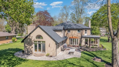 Back yard with firepit, firewood and outdoor table seating for 8