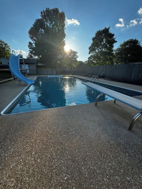 back yard is fully fenced. pool is gated with slid and diving board. 