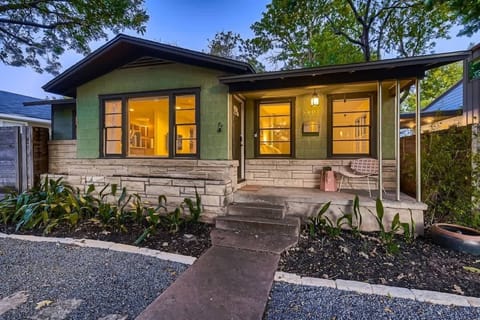 Beautifully landscaped garden surrounding a stylish, contemporary home.