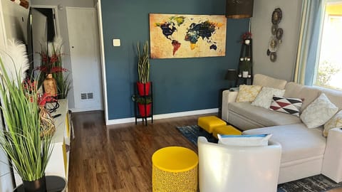 Bright and spacious living room, comfy sofa & smart TV perfect for relaxing