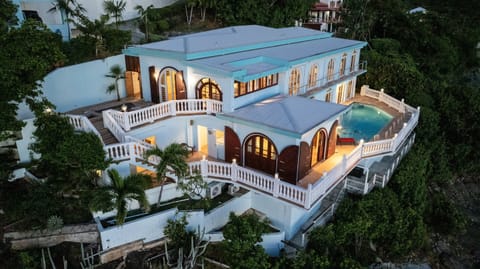 A cliffside escape with unobstructed views of the shimmering sea.