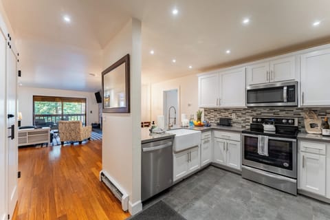 Kitchen features stainless steel appliances.