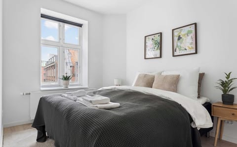 Bedroom 3 with a comfortable double-bed, built-in closets and blackout curtains to ensure you get a good nights sleep