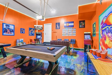 A playful oasis filled with bright orange hues and exciting entertainment options, from pool, airhockey, beerpong and foosball to arcade classics, making this the ultimate spot to unwind and have fun.