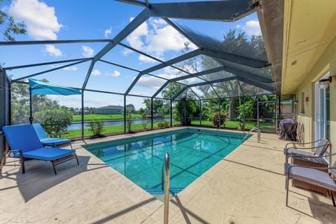 Enjoy the warm air, relax by the pool.  Umbrella, loungers, sitting. 