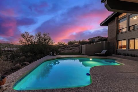 Relax and unwind with a serene twilight view from the pool