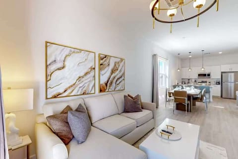 Unwind in the generous living room, perfect for family gatherings and cozy movie nights.