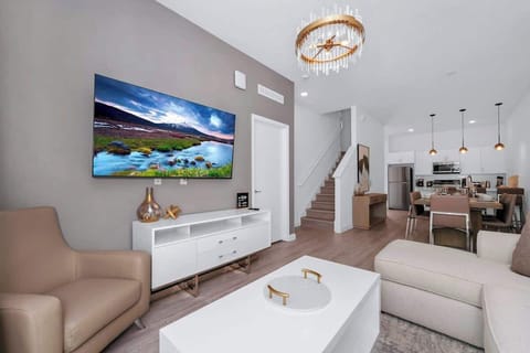 Spacious living room with a smart TV, perfect for movie nights and relaxation after a day of adventures.