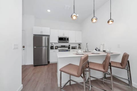 Fully equipped kitchen with modern appliances and ample space for home-cooked meals.