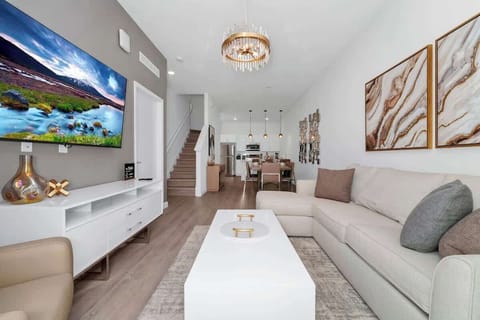 Spacious living room with a smart TV, perfect for movie nights and relaxation after a day of adventures.