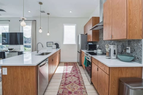 The chic, updated kitchen offers ample space & every home comfort