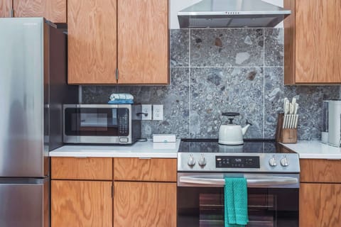 The chic, updated kitchen offers ample space & every home comfort